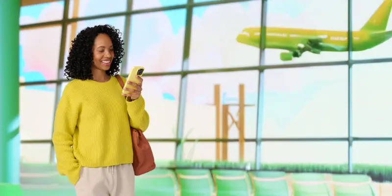 Woman talking on mobile phone at airport.